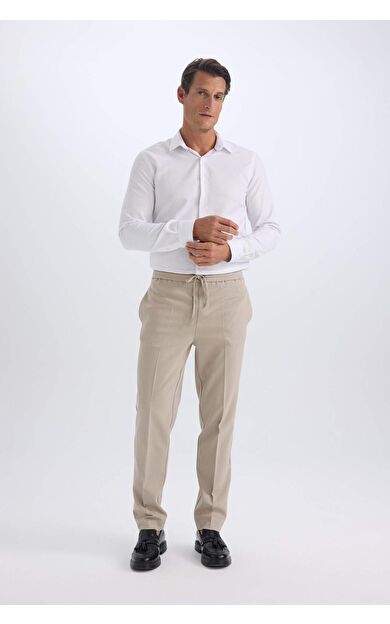 DeFacto Yazlık Kumaş Jogger Pantolon Beli Bağcıklı Lastikli Düz Paça Cepli Her Yöne Esneyen A9943AX25SPGR53