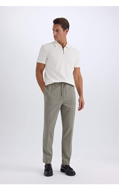 DeFacto Yazlık Kumaş Jogger Pantolon Beli Bağcıklı Lastikli Düz Paça Cepli Her Yöne Esneyen A9943AX25SPKH464