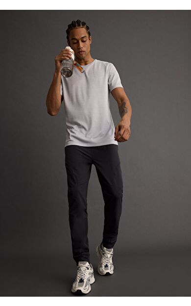 DeFacto DeFactoFit Slim Fit Dar Kesim Çift Cepli Fermuarlı Paça Dokuma Jogger B2780AX25AUAR231