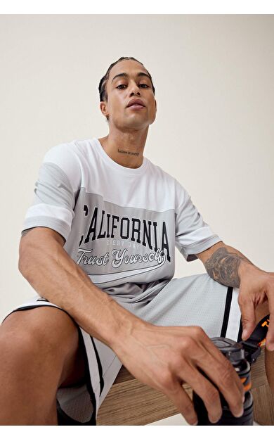 DeFactoFit Oversize Geniş Kalıp Bisiklet Yaka Baskılı Sporcu Kısa Kollu Tişört E4122AX25SMGR91